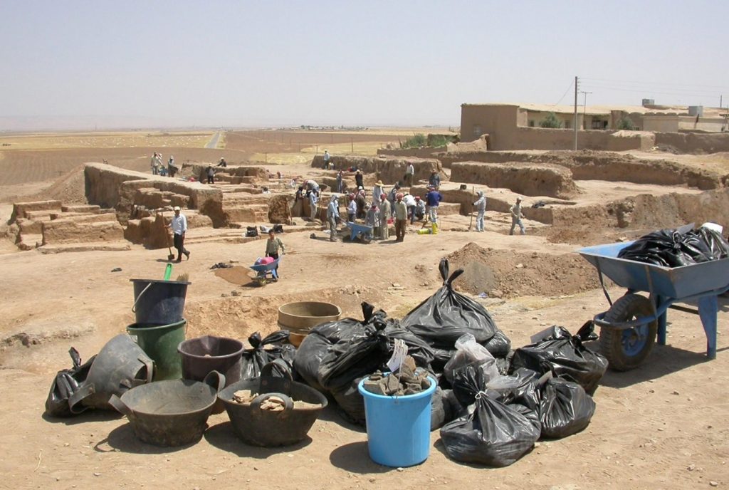 Excavation of Akkadian Palace at Tell Leilan in 2006. Flotation samples and baskets of pottery are shown in the foreground.